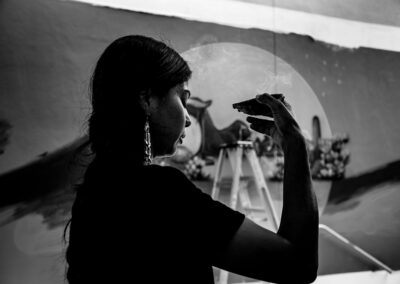 Black and white photo of artist La Morena during her ritual before painting her mural at the Miraval Resort is Tucson, Marana, Arizona.